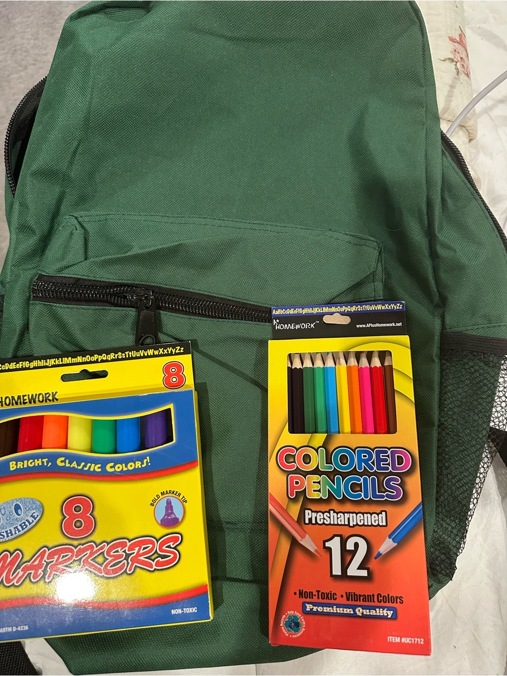 Green Canvas Backpack with Colored Pencils